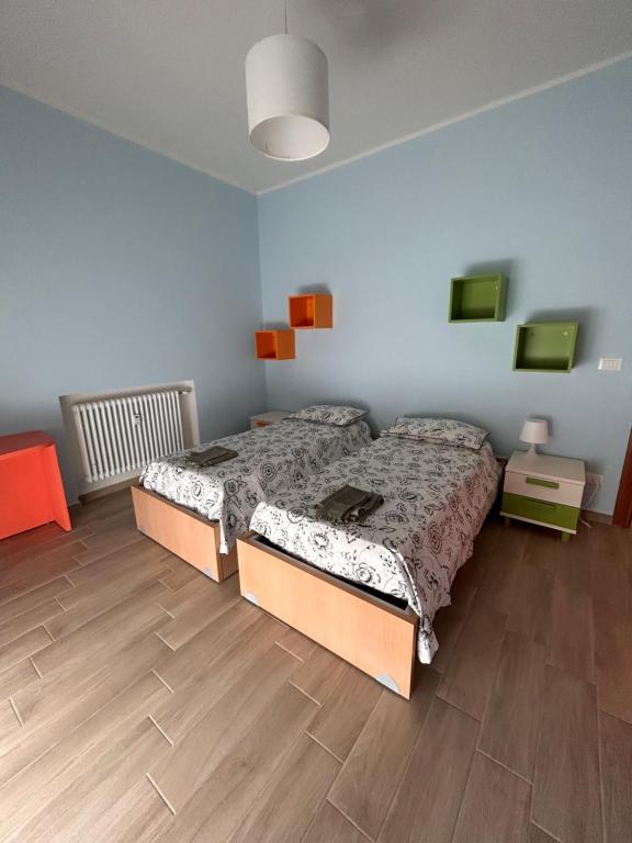 Łóżko lub łóżka w pokoju w obiekcie Casa di Ily