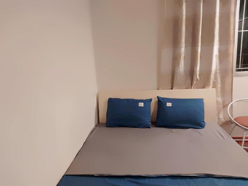 Postel nebo postele na pokoji v ubytování Da Tree Homestay