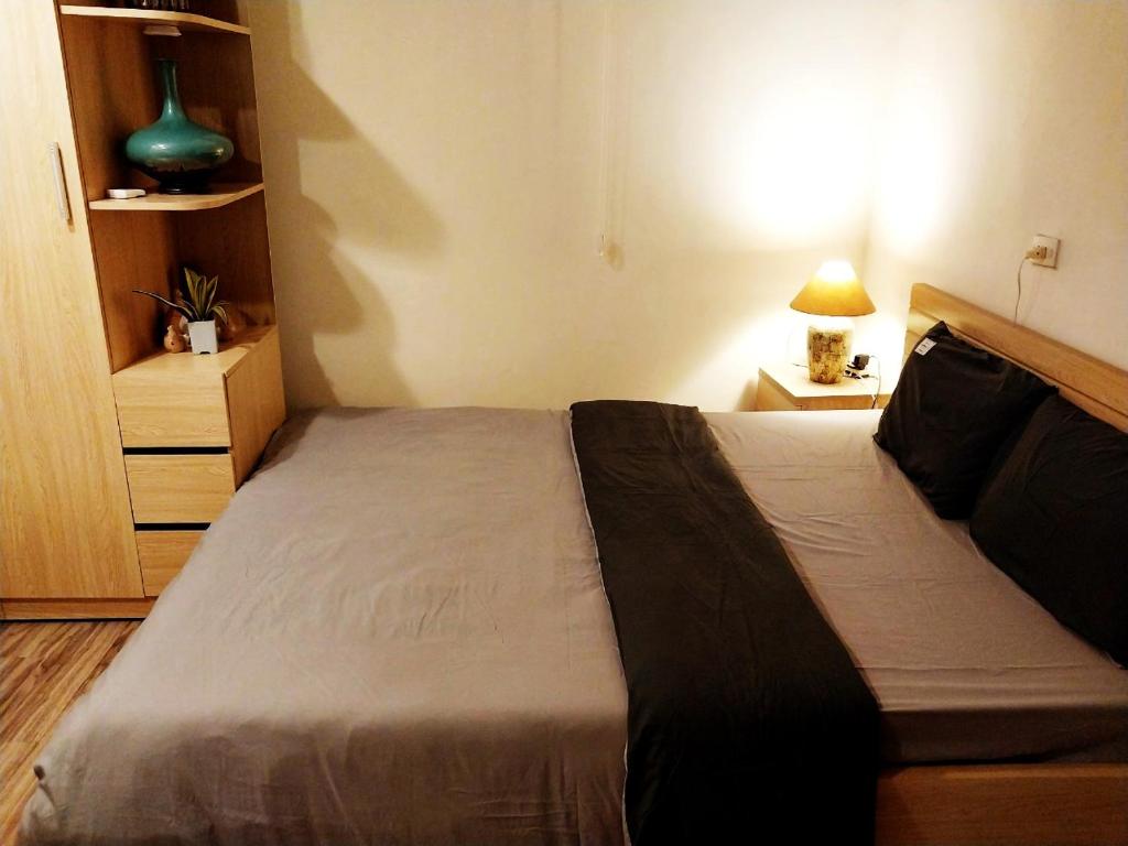 Postel nebo postele na pokoji v ubytování Da Tree Homestay