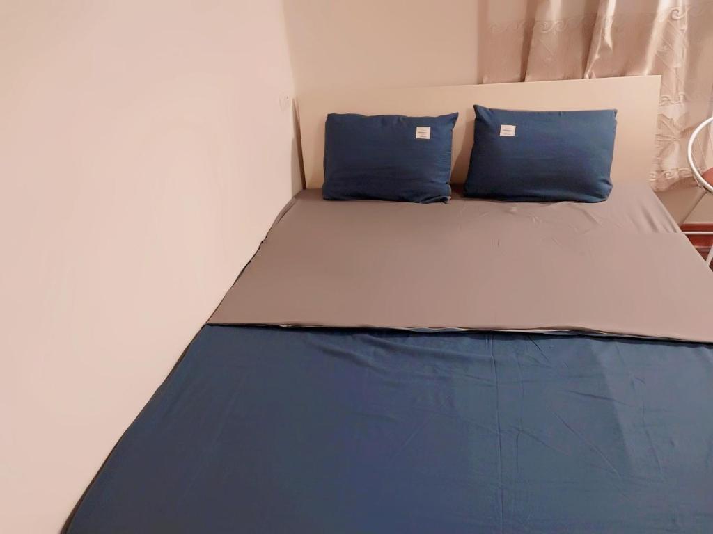 Postel nebo postele na pokoji v ubytování Da Tree Homestay