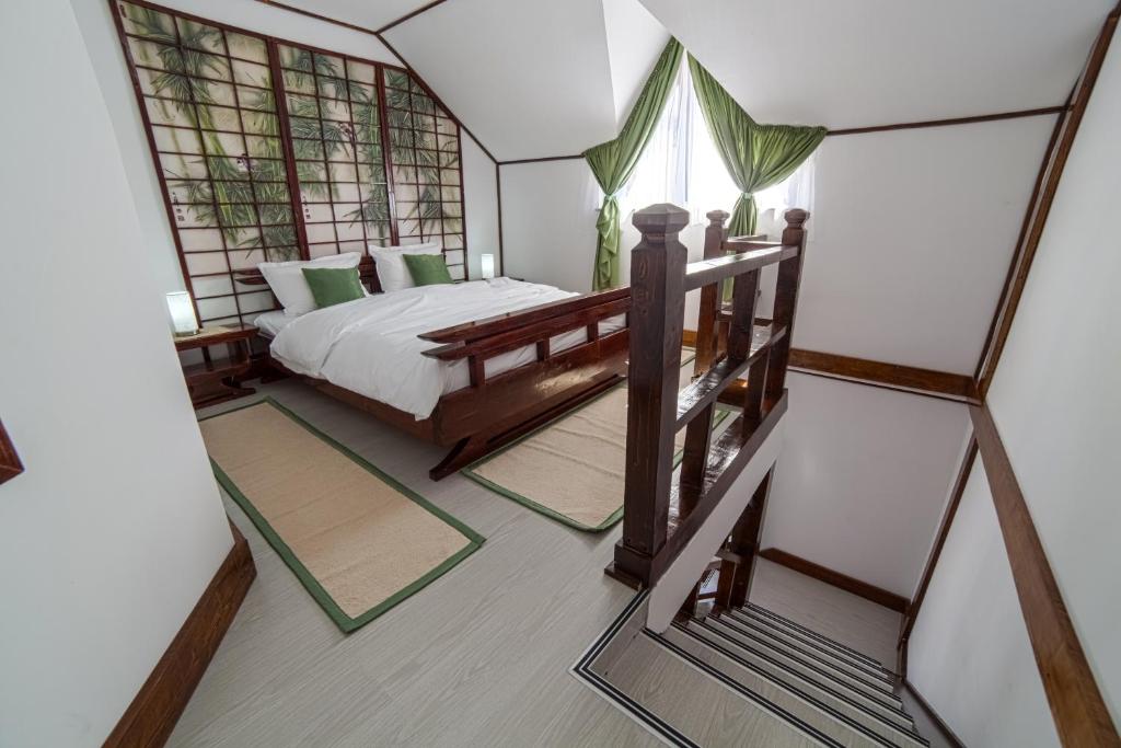 Ένα ή περισσότερα κρεβάτια σε δωμάτιο στο Casa Lily - Japanese Retreat