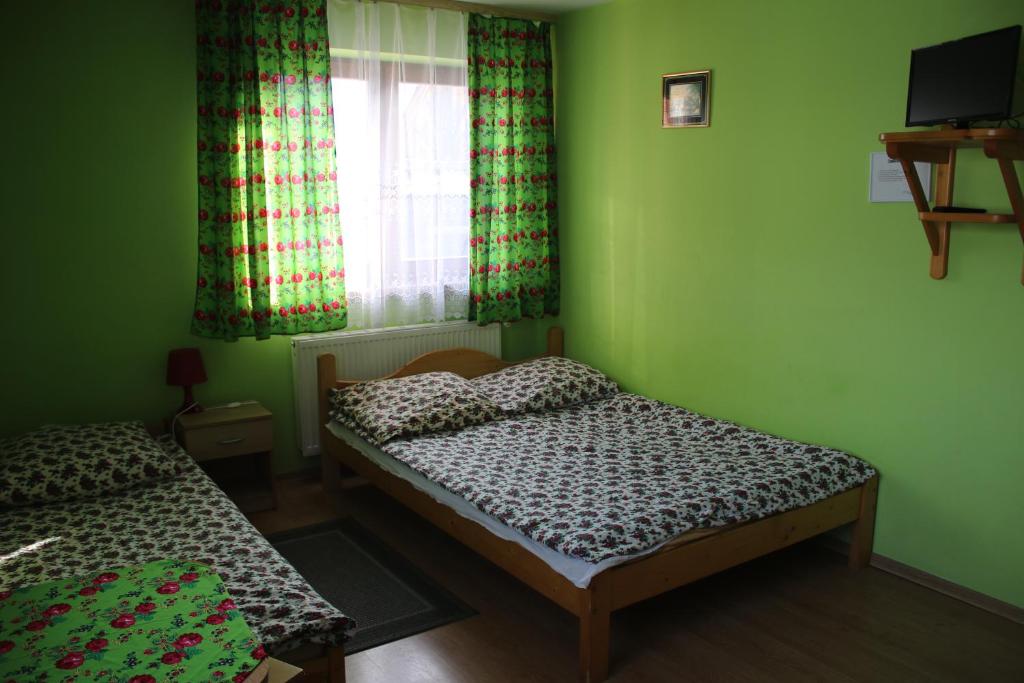 Posteľ alebo postele v izbe v ubytovaní Pokoje Gościnne Łukaszczyk