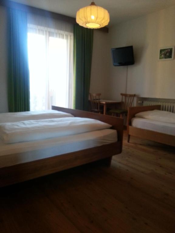 Postel nebo postele na pokoji v ubytování Pension Panorama
