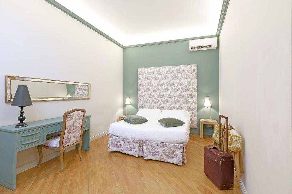 Postel nebo postele na pokoji v ubytování Boutique Hotel Anahi