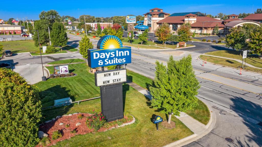a sign for days inn and suites on a street at Days Inn & Suites by Wyndham Mt Pleasant in Mount Pleasant