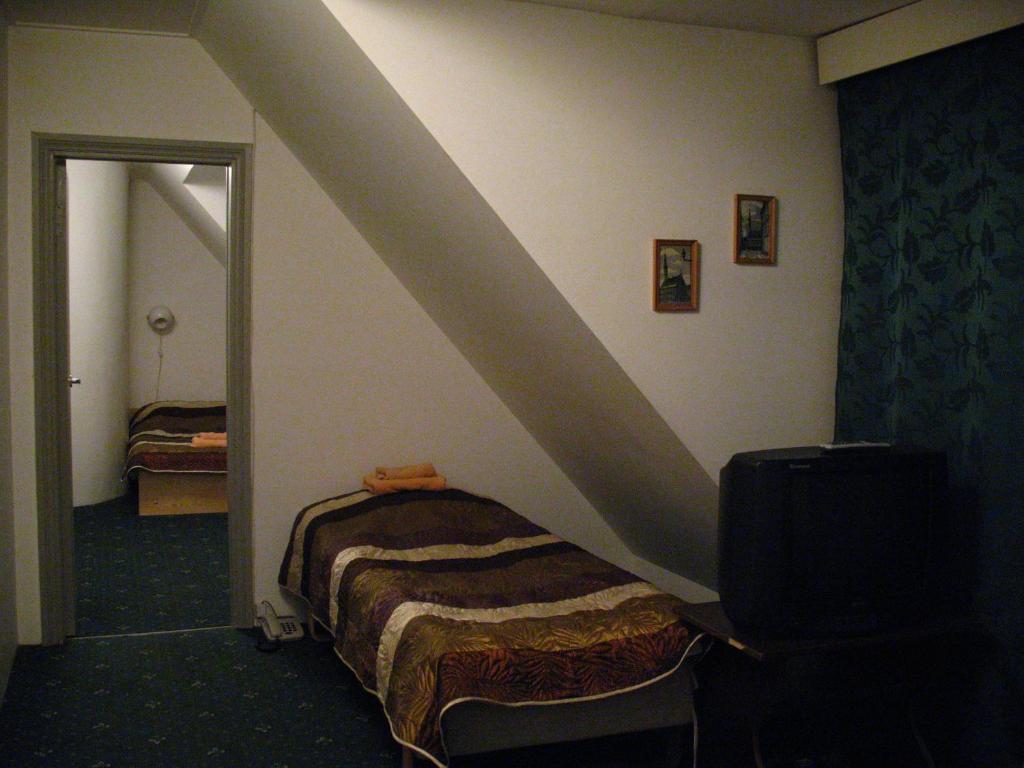 Postel nebo postele na pokoji v ubytování Nepi Hotell