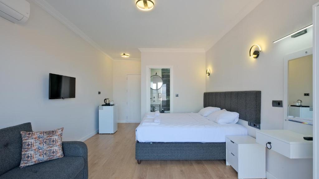 Postel nebo postele na pokoji v ubytování Miralya Suites