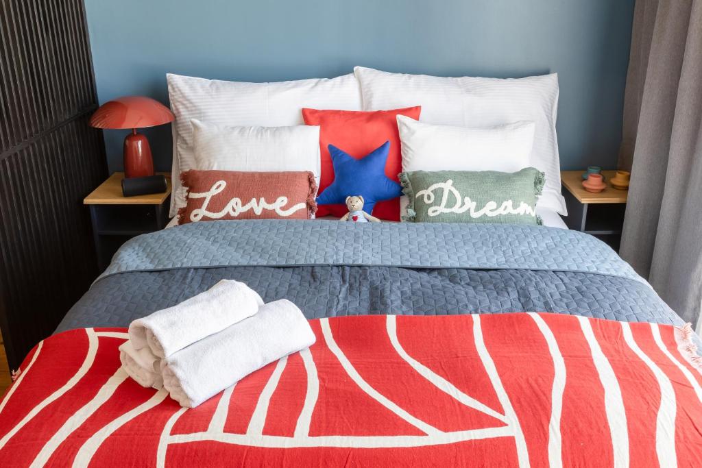 a bed with towels and pillows on it at Urban Chic Residences in Prague