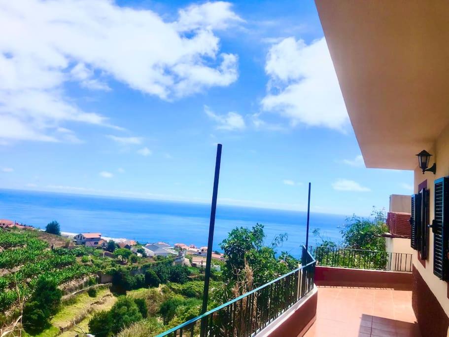 a balcony with a view of the ocean at Casa Vista Mar -2 bedrooms,fantastic Seaview in Estreito da Calheta