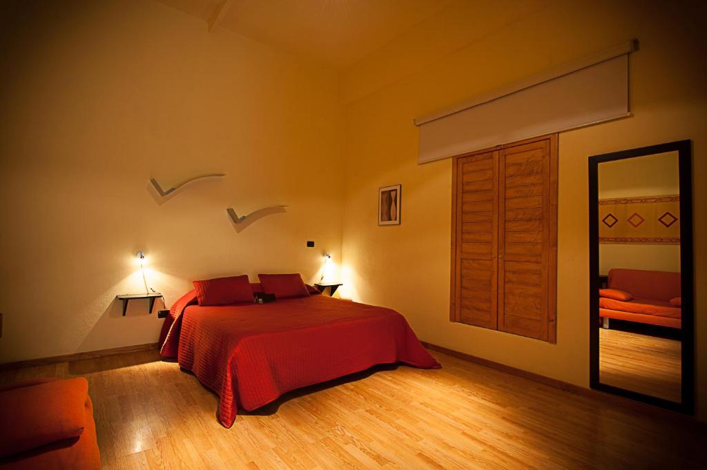 Postel nebo postele na pokoji v ubytování Albergo Tripoli B&B Affittacamere
