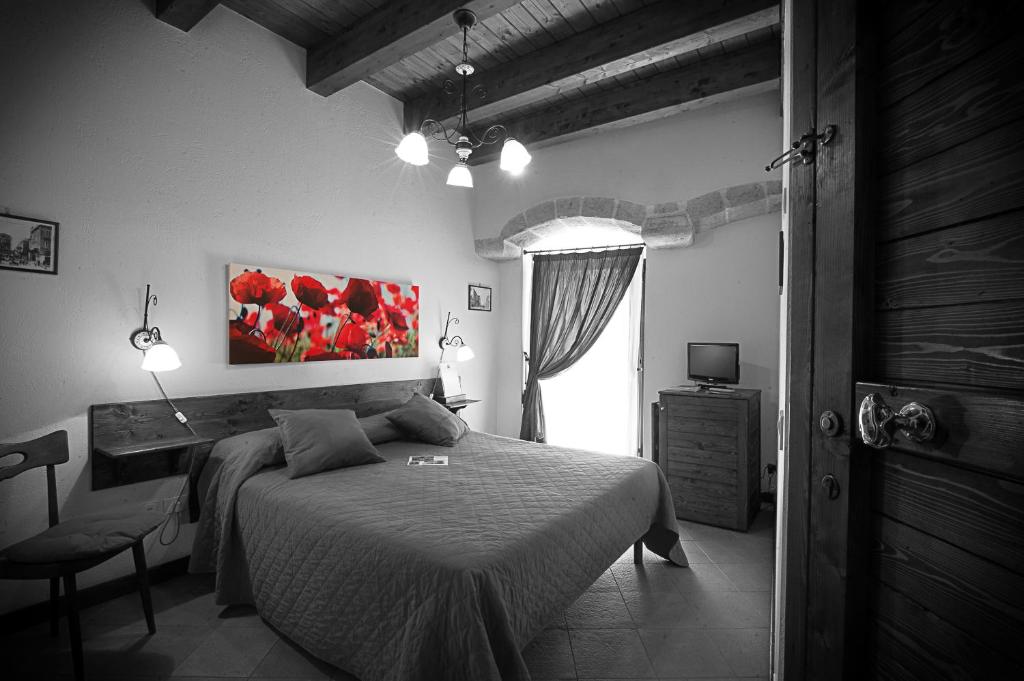 Postel nebo postele na pokoji v ubytování Albergo Tripoli B&B Affittacamere