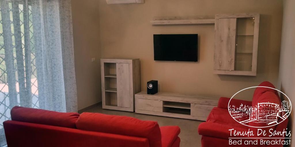 TV a/nebo společenská místnost v ubytování Tenuta De Santis