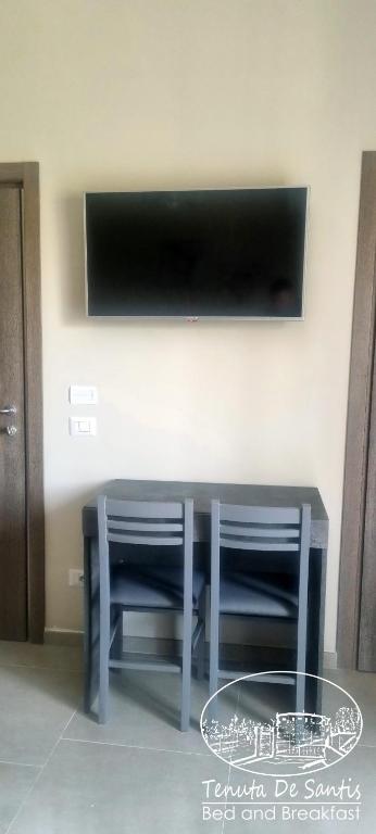 TV a/nebo společenská místnost v ubytování Tenuta De Santis