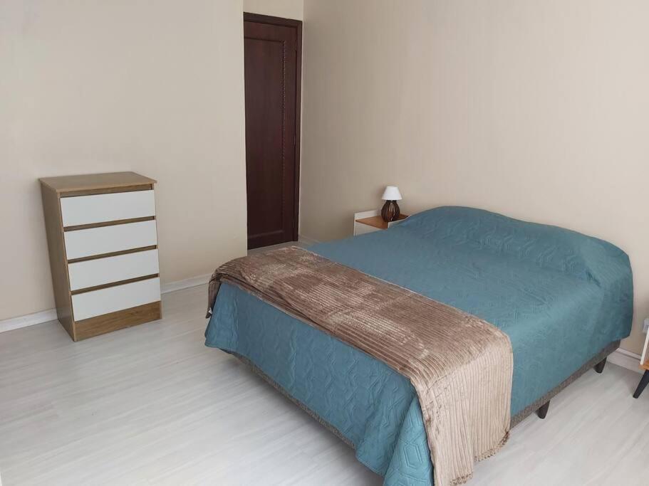 Кровать или кровати в номере Grande Apartamento Central