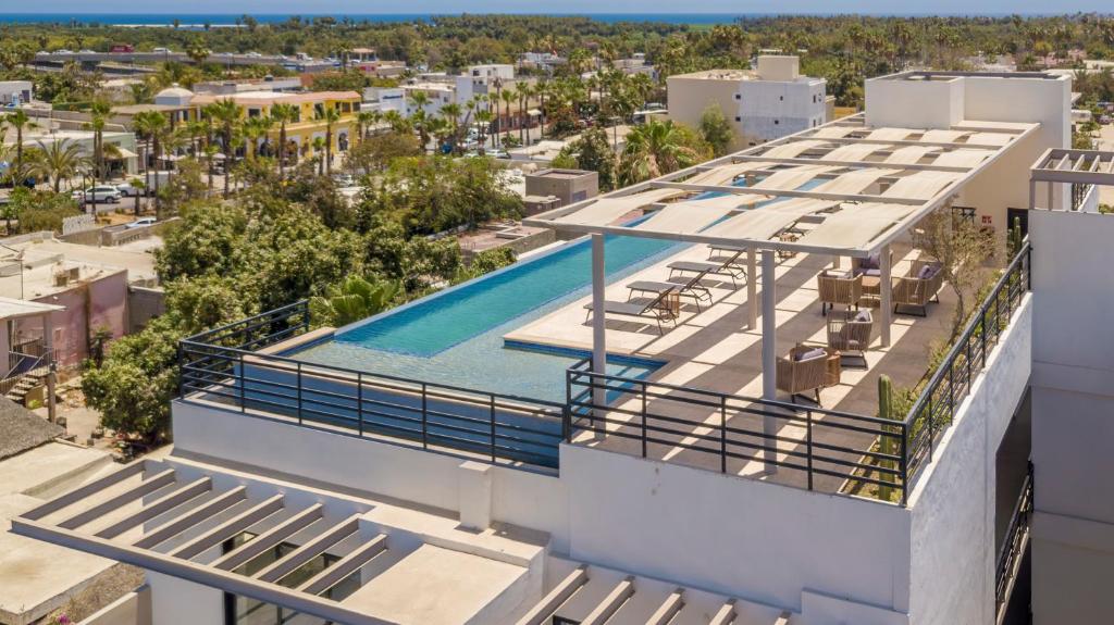 an aerial view of a building with a swimming pool at Lumina at Cardinal San José del Cabo in San José del Cabo
