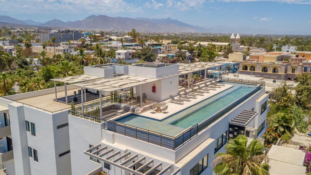 an aerial view of a building with a swimming pool at Lumina at Cardinal San José del Cabo in San José del Cabo