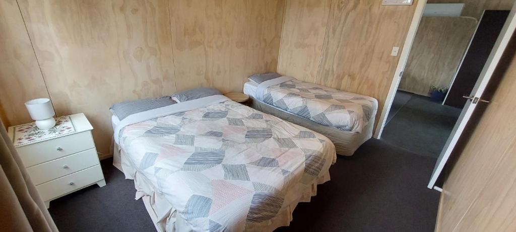 Postel nebo postele na pokoji v ubytování Tongariro Estate