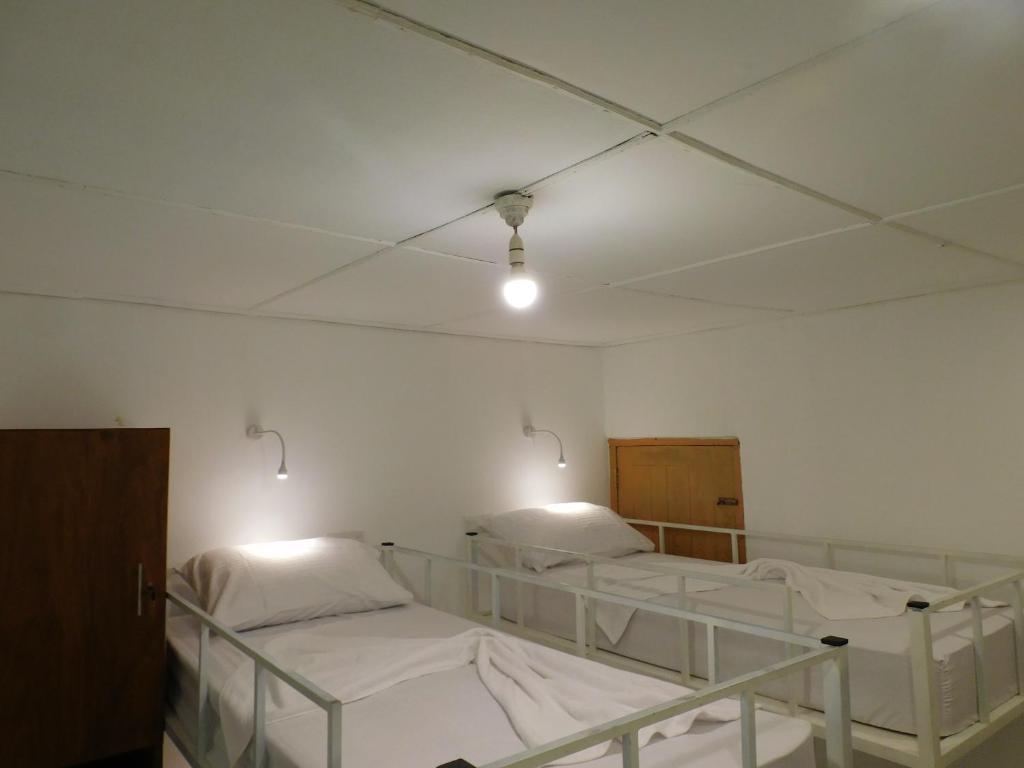 Postel nebo postele na pokoji v ubytování Kutumbaya