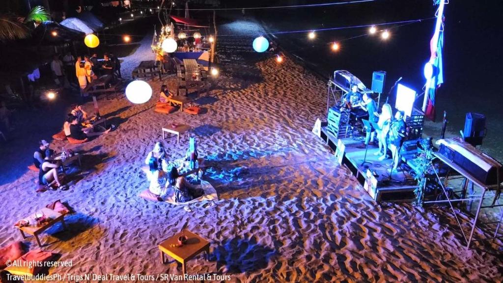 an overhead view of a stage on a beach at night at Samba Bluewater Resort in Olongapo