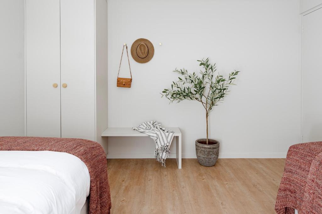 Postel nebo postele na pokoji v ubytování Motel Caloundra