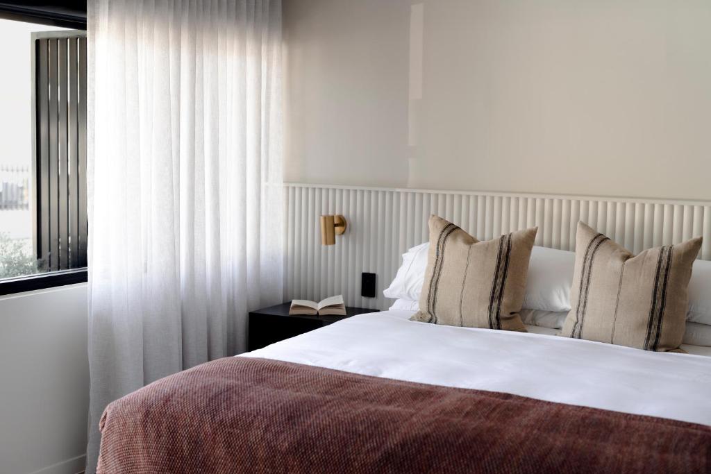 Postel nebo postele na pokoji v ubytování Motel Caloundra