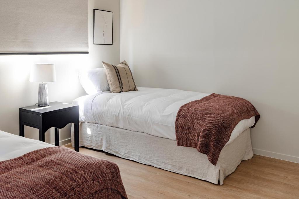 Postel nebo postele na pokoji v ubytování Motel Caloundra