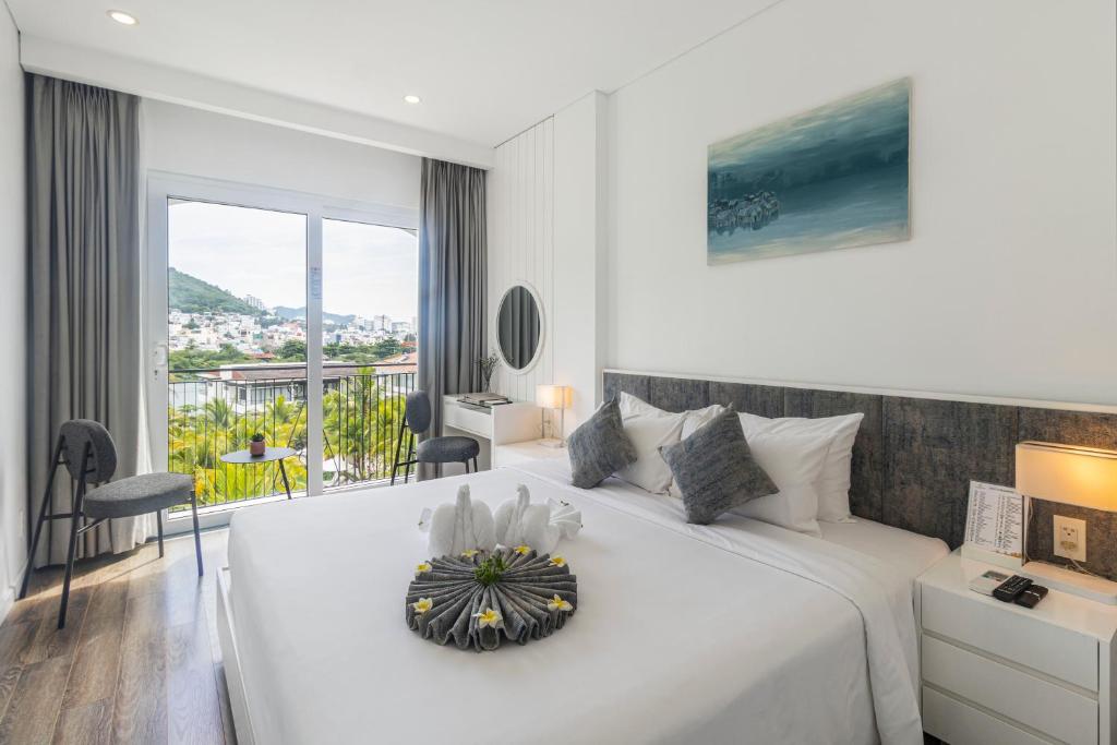 Giường trong phòng chung tại Champa Island Nha Trang - Resort Hotel & Spa