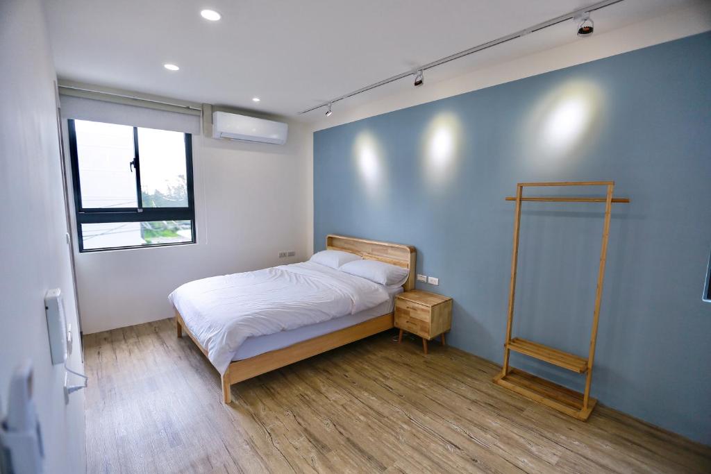 Postel nebo postele na pokoji v ubytování 青逸居 桃園中壢民宿 親子包棟 Qing Yi Ju