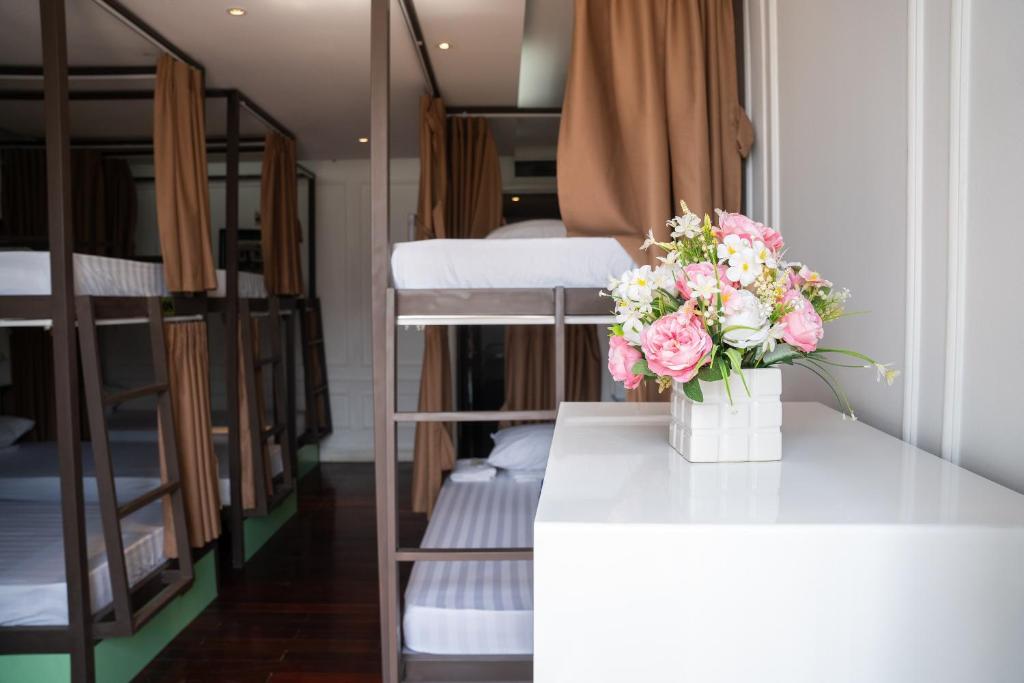 Postel nebo postele na pokoji v ubytování Hanoi Traveller House