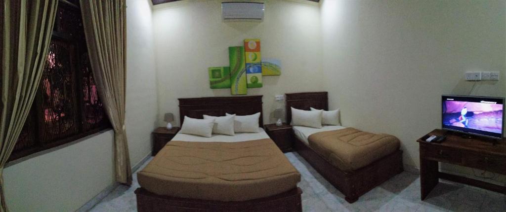 Postel nebo postele na pokoji v ubytování holidays hotel
