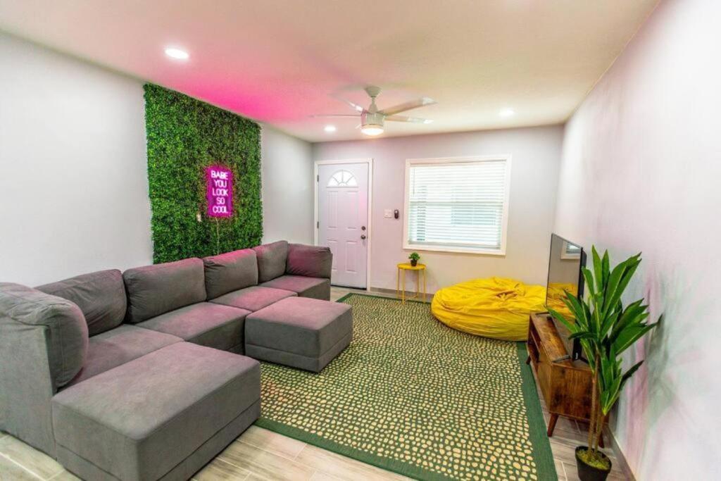 a living room with a couch and a table at Cocoanut neighborhood, king bed in Sarasota