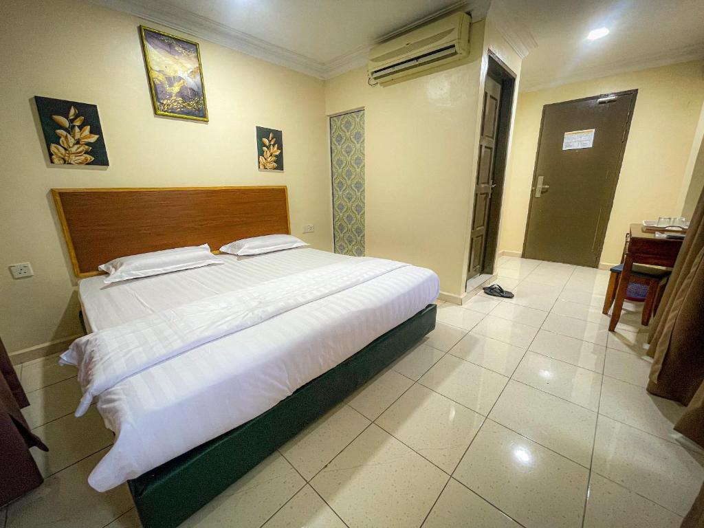 Postel nebo postele na pokoji v ubytování The Hotel