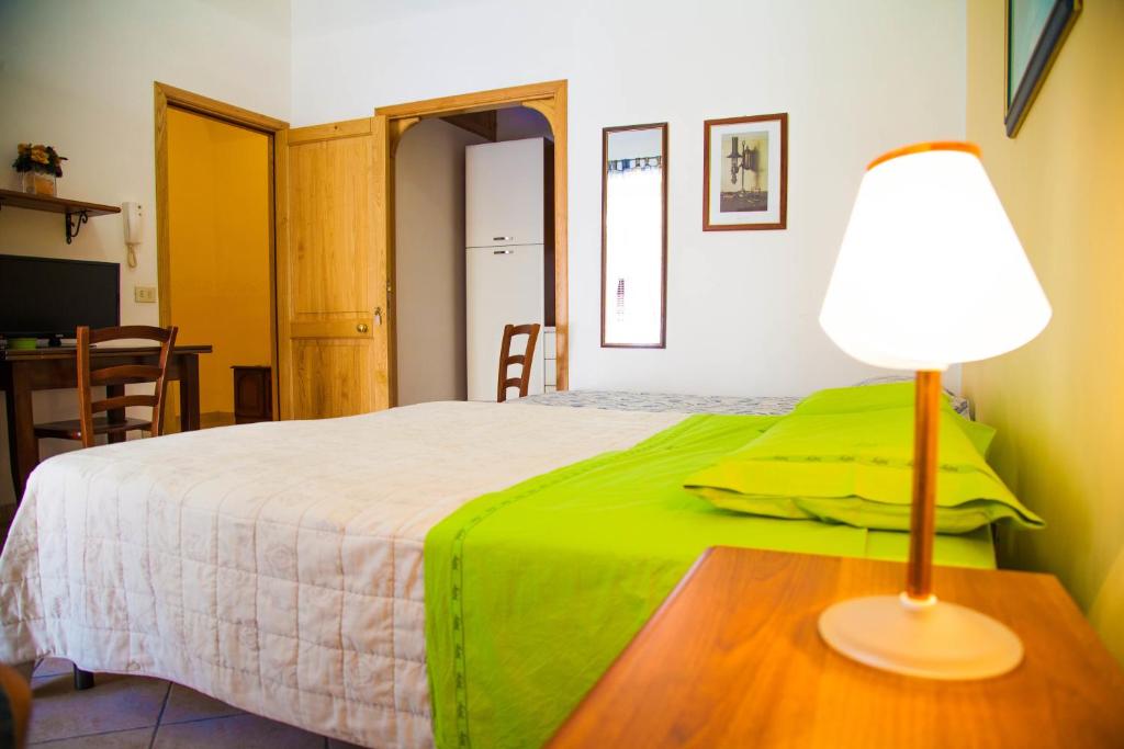 Rúm í herbergi á Bed & Breakfast Il Castellino