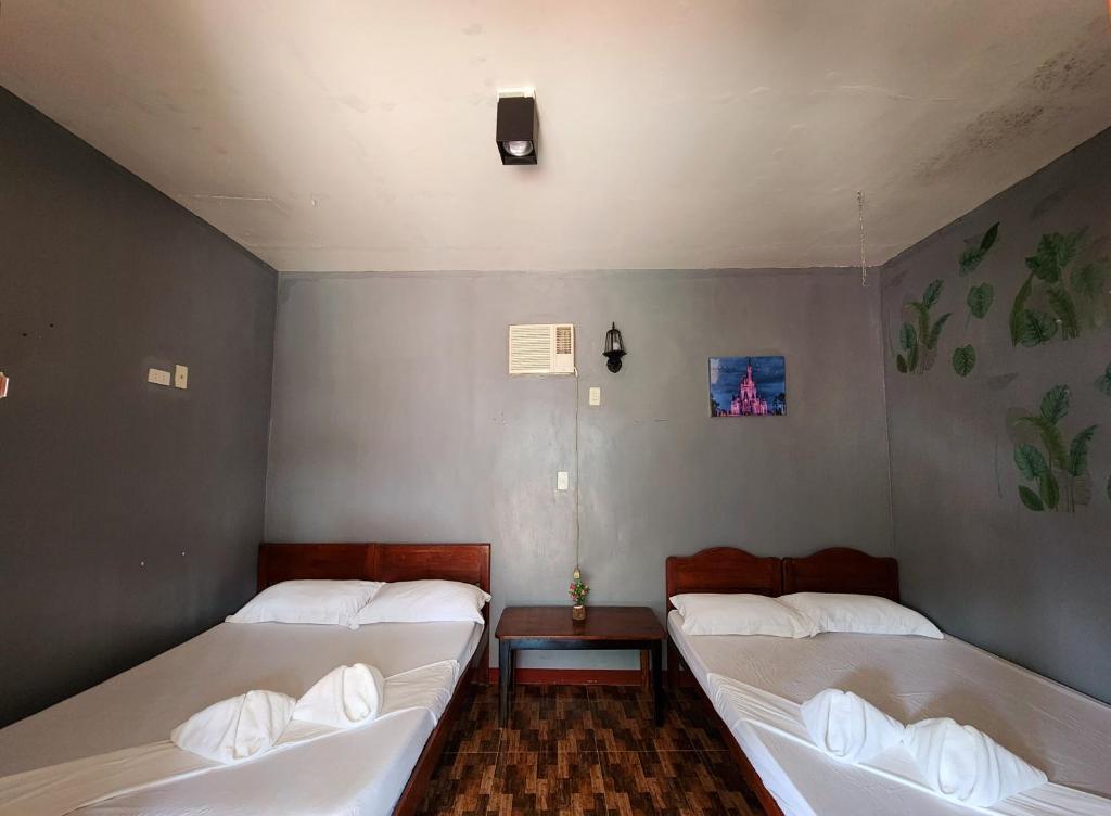 Postel nebo postele na pokoji v ubytování Uno Dus Tourist Inn