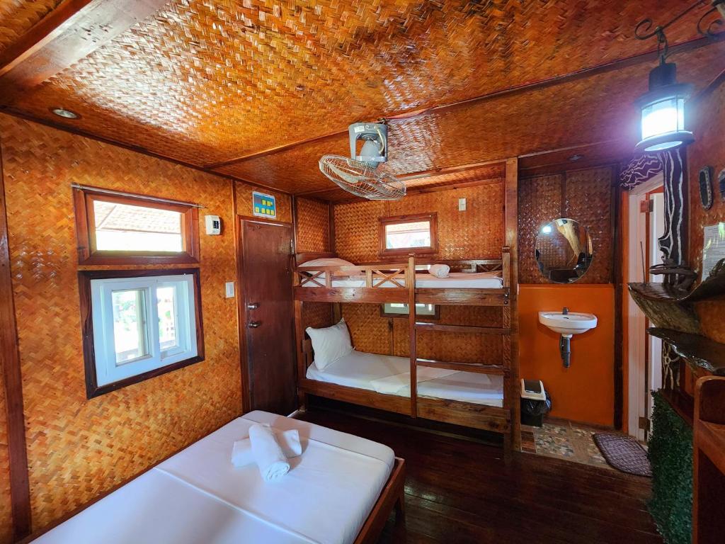Postel nebo postele na pokoji v ubytování Uno Dus Tourist Inn