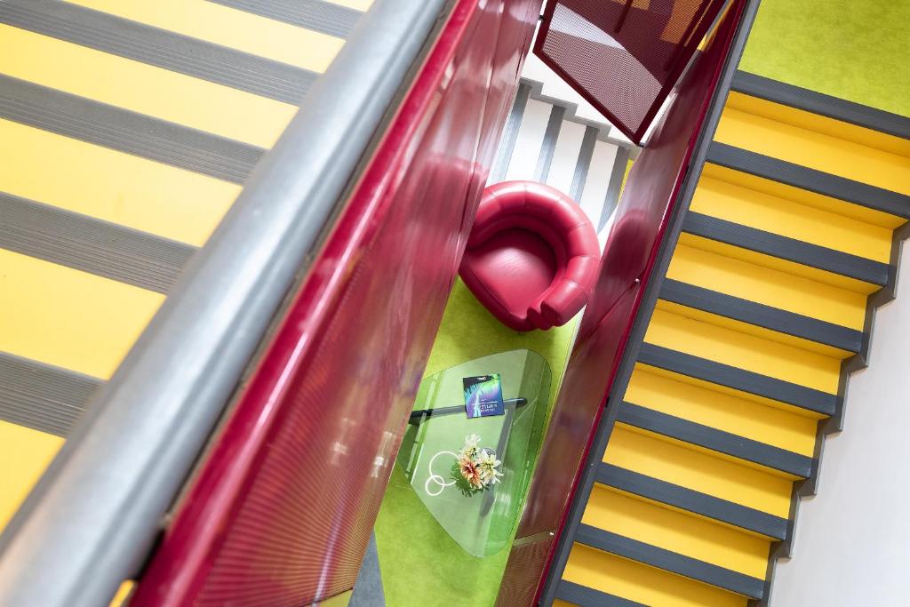 an overhead view of an escalator at Bohoostel in Bologna