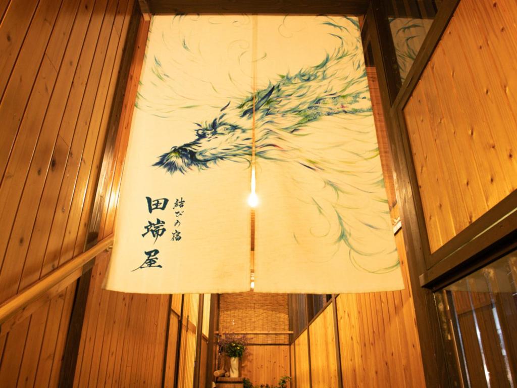 un dipinto cinese sul muro di una stanza di Tabataya a Myoko