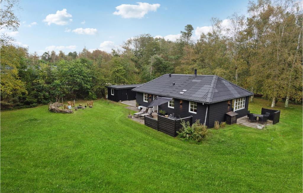 an aerial view of a black house in a field at Gorgeous Home In Hadsund With Wifi in Hadsund