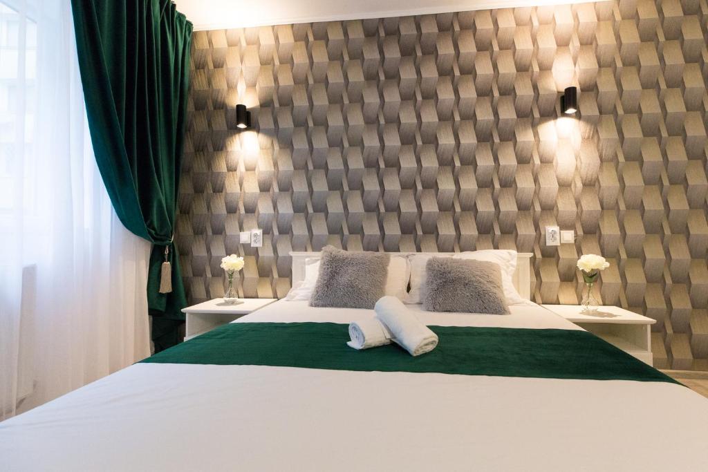 Un pat sau paturi într-o cameră la Best room