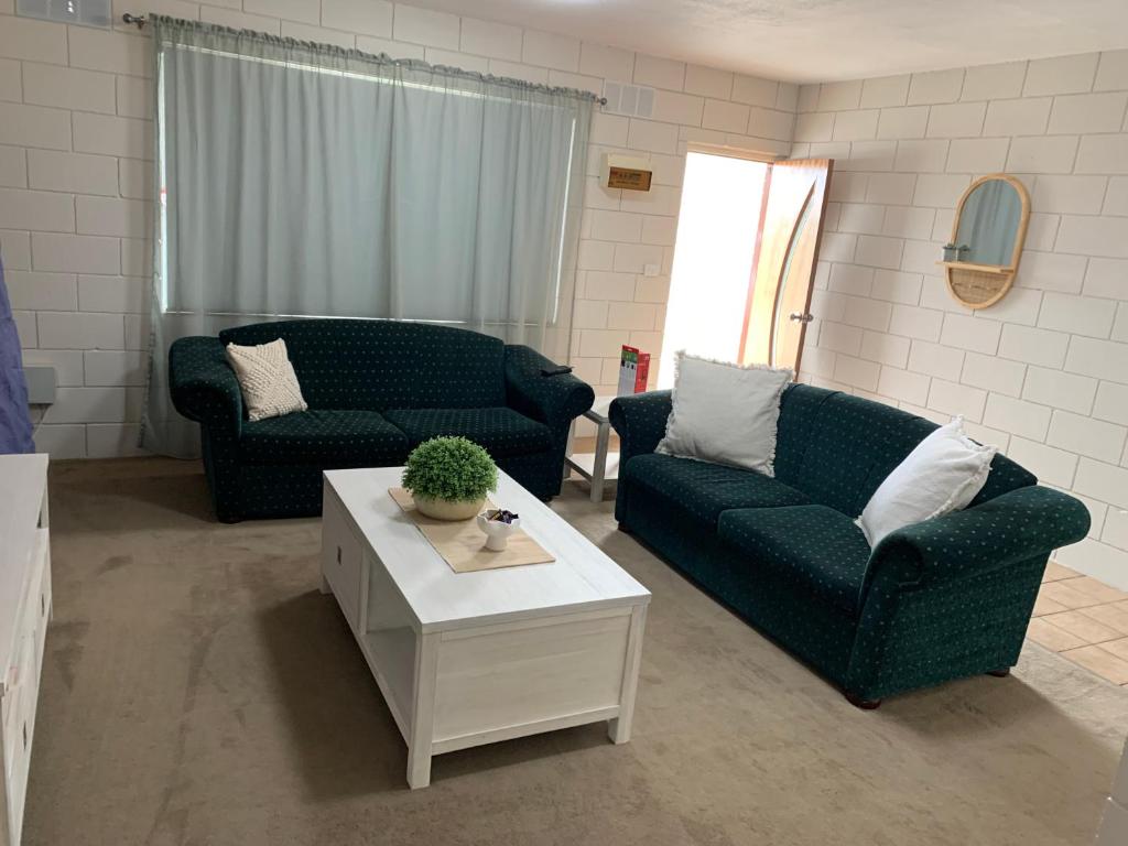 a living room with two couches and a coffee table at Harbour View 49 Urch Street Unit 7 in Geraldton