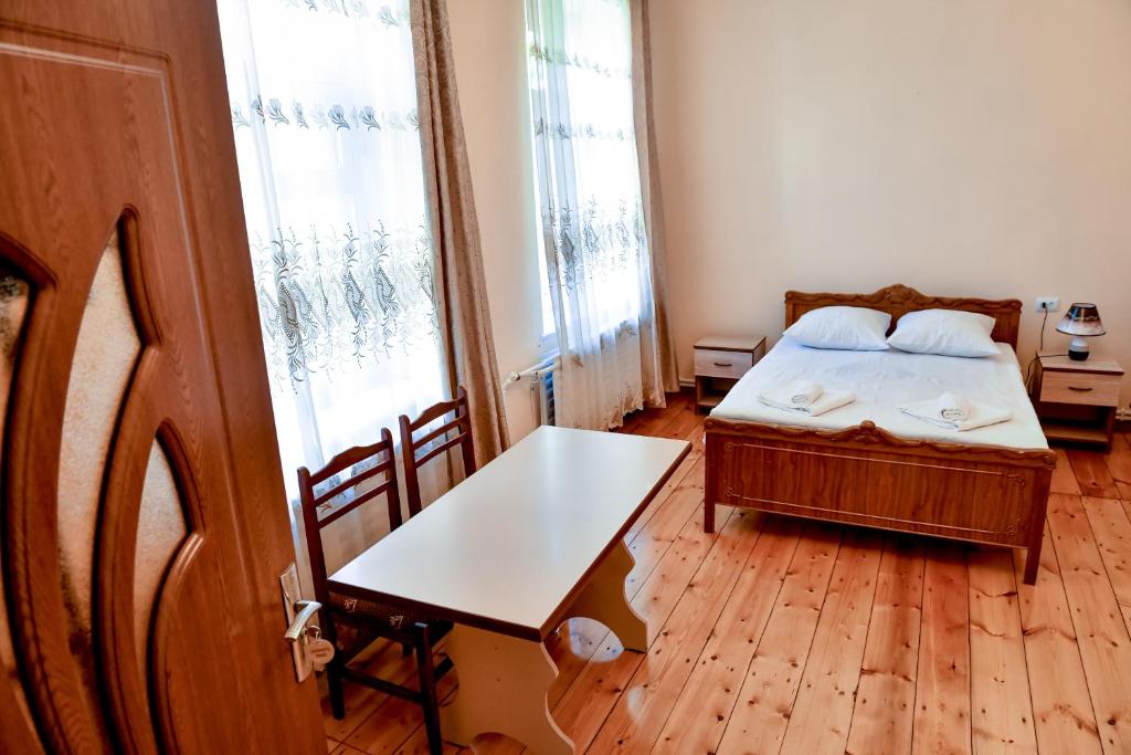 Postel nebo postele na pokoji v ubytování Guest House David's B&B