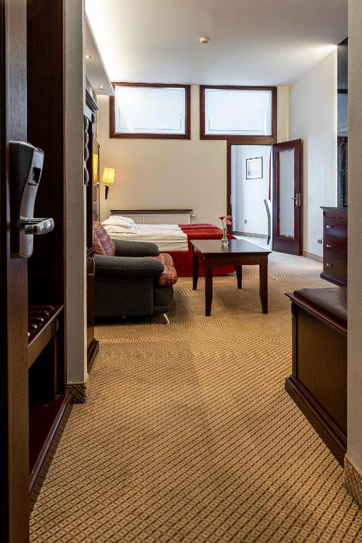Postel nebo postele na pokoji v ubytování Hotel Galicja Superior Wellness & Spa