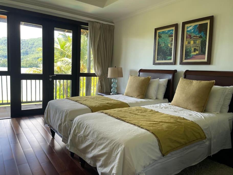 Ένα ή περισσότερα κρεβάτια σε δωμάτιο στο Paradise Villa Eden Island