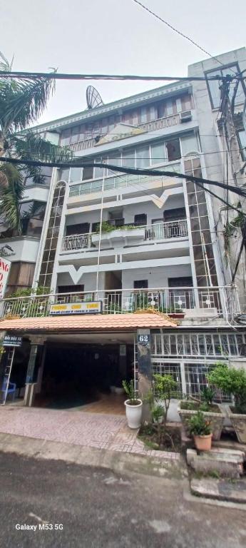 a large white building with a courtyard in front of it at Nhật Bình 2 in Ho Chi Minh City