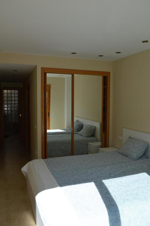 Posteľ alebo postele v izbe v ubytovaní Barraca Beach