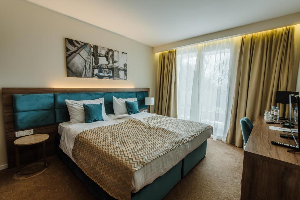 Postel nebo postele na pokoji v ubytování Hotel Nais