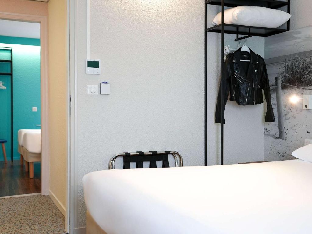 Postel nebo postele na pokoji v ubytování ibis Styles Quimper