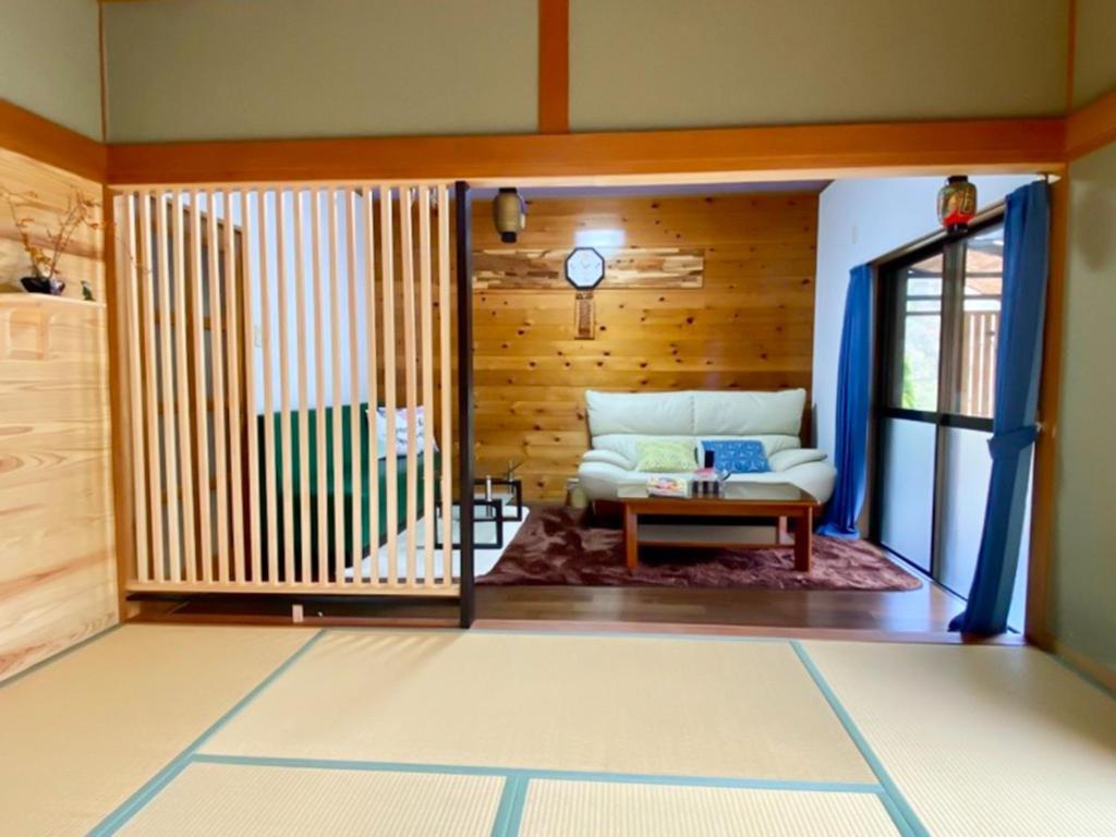 a living room with a couch and a table at Oyado Nagomi - Vacation STAY 29876v in Takamatsu
