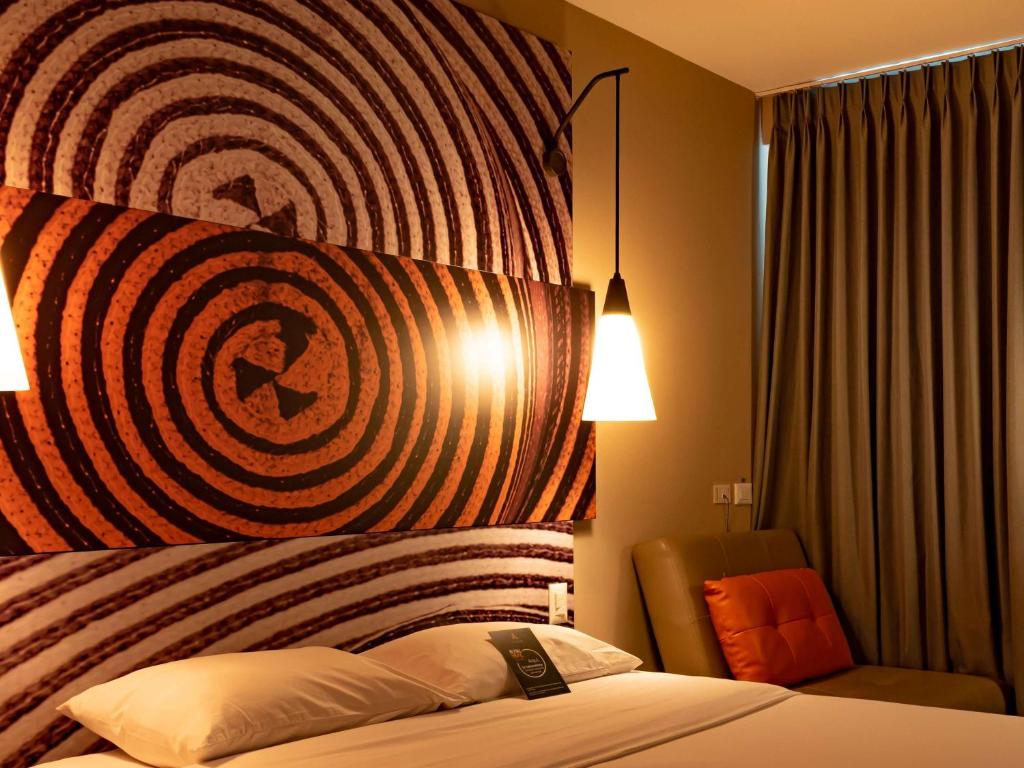 Postel nebo postele na pokoji v ubytování ibis Apartado