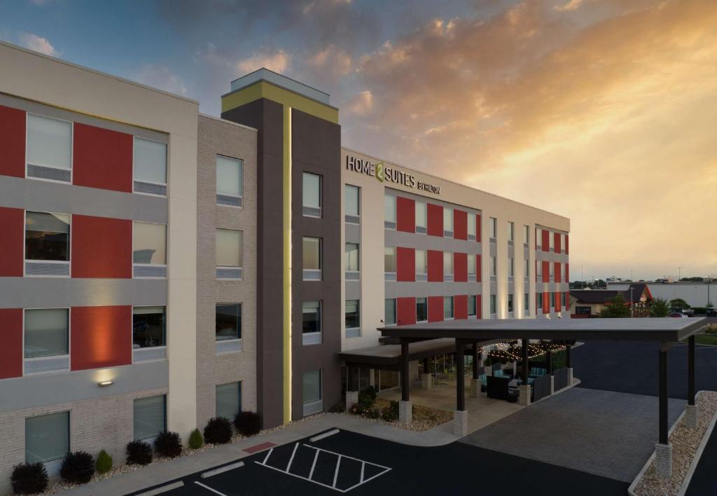a rendering of a hotel with a sunset in the background at Home2 Suites Troy, OH in Troy
